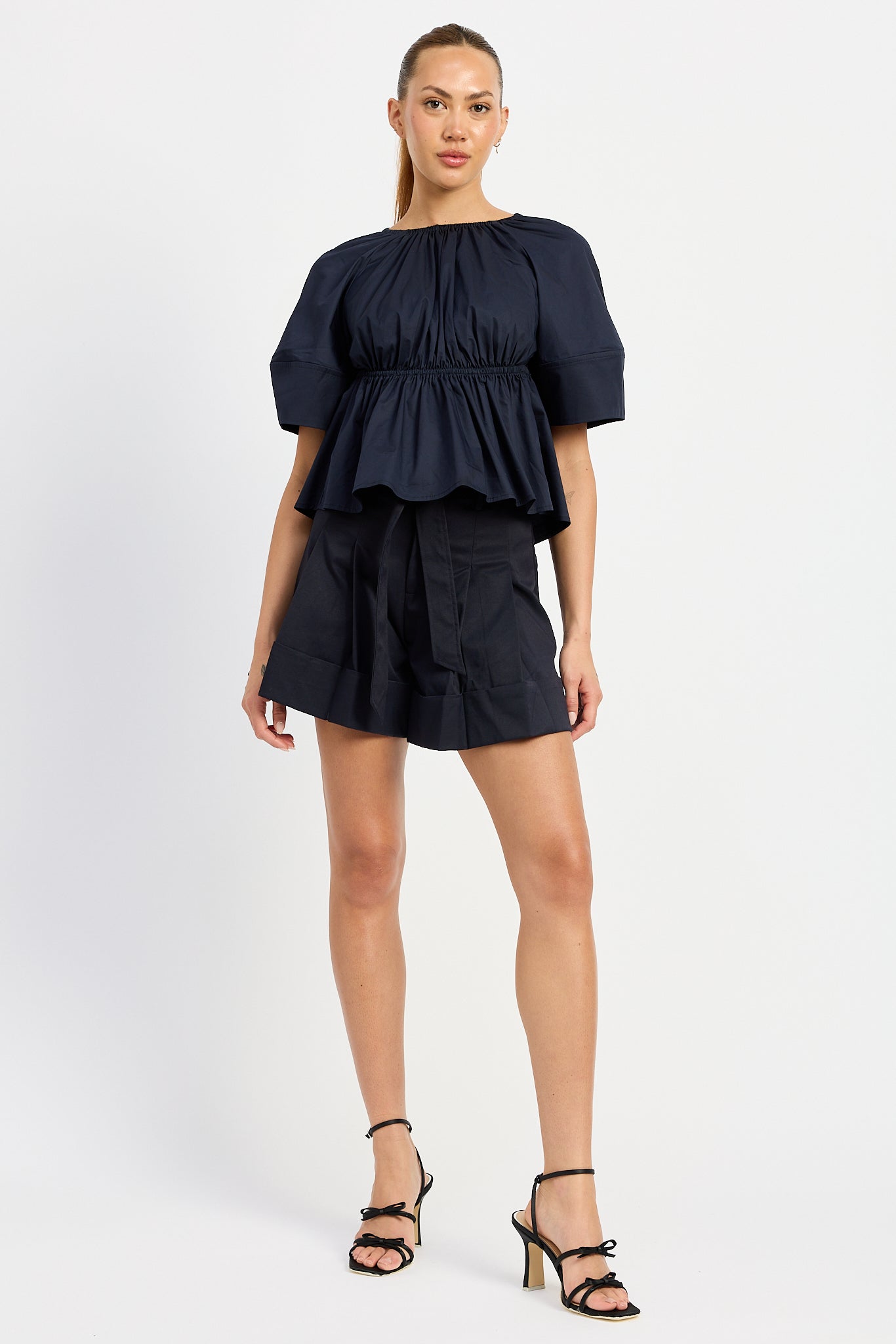 NAVY PLEATED BELTED SHORTS