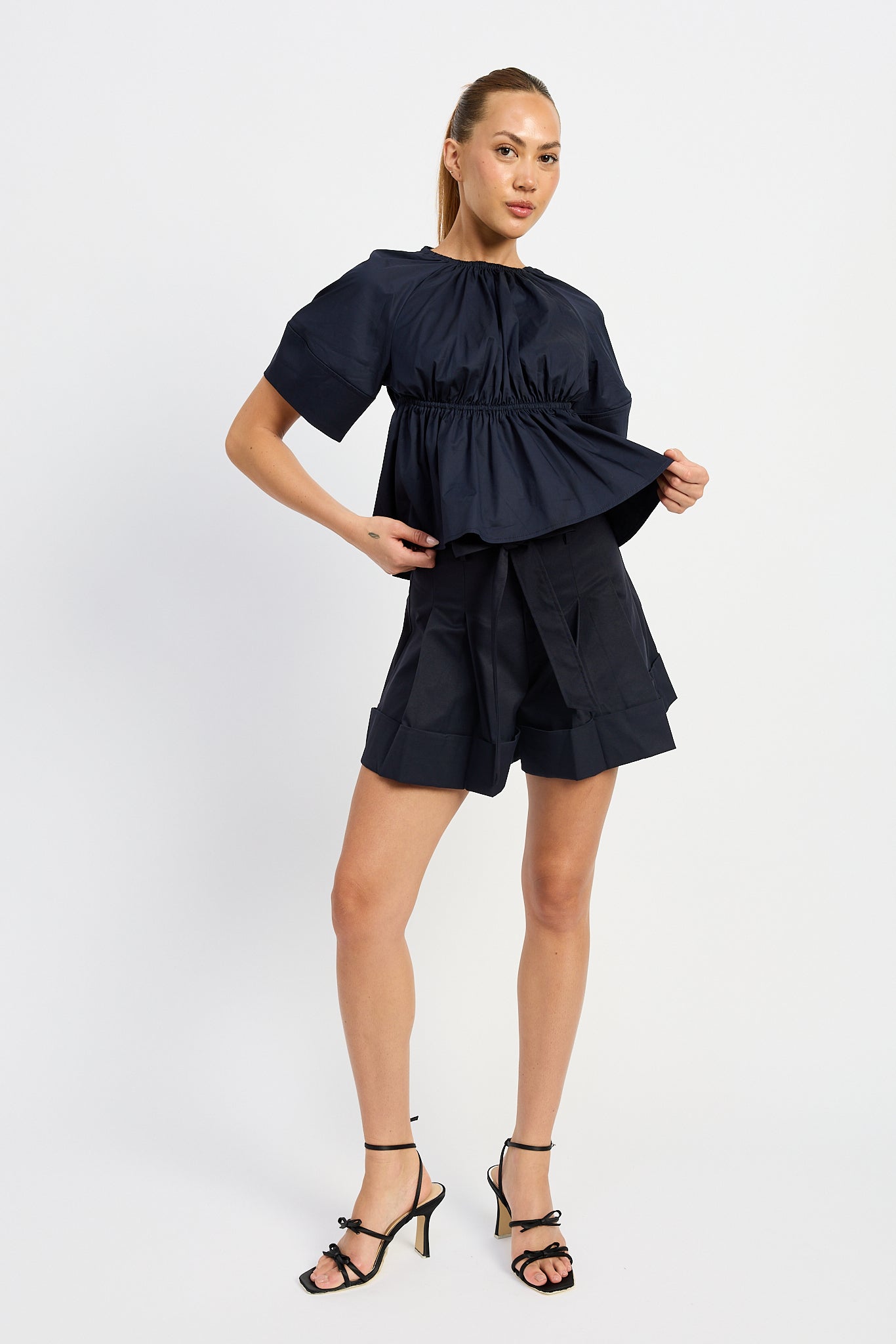 NAVY PLEATED BELTED SHORTS