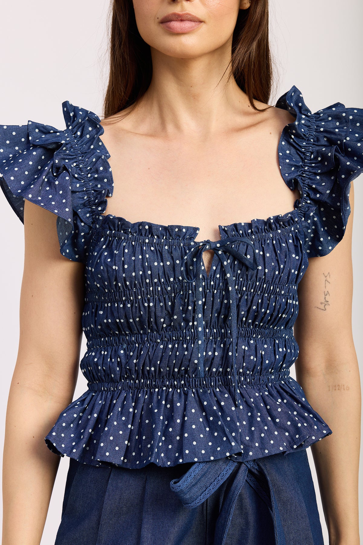 NAVY PEPLUM TOP